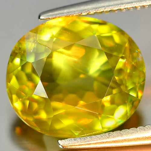 Intense Green Titanium Sphene Red Spark 4.03 Ct. Natural Oval 10.8 x 9.3 Mm.