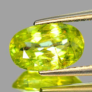 1.95 Ct. Intense Yellowish Green Titanium Sphene With Rainbow Spark Oval Shape