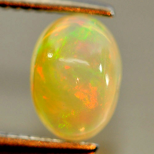 0.59 Ct. Oval Cab Natural Gem Play Of Colour Multi Color Opal Unheated