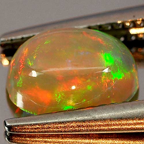 0.64 Ct. Oval Cab Natural Gem Multi Color Play Of Colour Opal Unheated