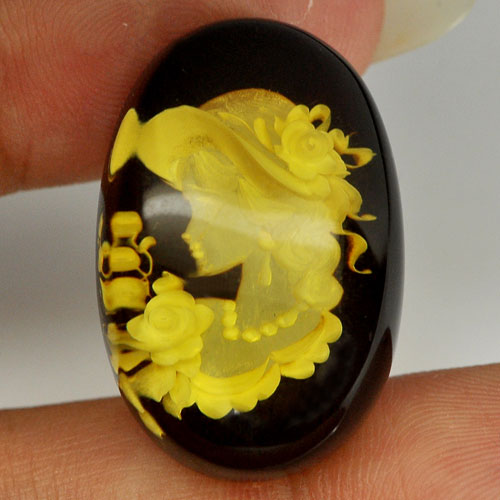 Women In Brown Yellow Amber 14.79 Ct. Oval Cabochon Shape 27 x 18 Mm. Natural