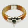 388.77 Ct. Natural Gemstone Brown Honey Jade Bangle with Silver Size80x61x18Mm. 388.77 Ct. Natural Gemstone Brown Honey Jade Bangle with Silver Size80x61x18Mm.