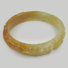 255.25 Ct. Natural Gem Honey Brown Jade Bangle Dragon Carving Size 80x65x15 mm. 255.25 Ct. Natural Gem Honey Brown Jade Bangle Dragon Carving Size 80x65x15 mm.