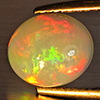 Natural Multi-Color Play Of Colour Opal Gemstone 4.11 Ct. Oval Cabochon Shape 12.5 x 10 Mm. Natural Multi-Color Play Of Colour Opal Gemstone 4.11 Ct. Oval Cabochon Shape 12.5 x 10 Mm.