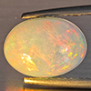 Natural Multi-Color Play Of Colour Opal Gemstone 1.75 Ct. Oval Cabochon Shape 10.3 x 7.7 Mm. Natural Multi-Color Play Of Colour Opal Gemstone 1.75 Ct. Oval Cabochon Shape 10.3 x 7.7 Mm.