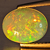 Natural Multi-Color Play Of Colour Opal Gemstone 1.68 Ct. Oval Cabochon Shape 10.5 x 8.4 Mm. Natural Multi-Color Play Of Colour Opal Gemstone 1.68 Ct. Oval Cabochon Shape 10.5 x 8.4 Mm.