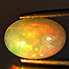 Natural Multi-Color Play Of Colour Opal Gemstone 2.23 Ct. Oval Cabochon Shape 12 x 8.2 Mm. Natural Multi-Color Play Of Colour Opal Gemstone 2.23 Ct. Oval Cabochon Shape 12 x 8.2 Mm.
