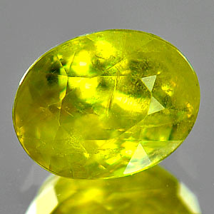 1.49 Ct. Oval Shape Natural Green Titanium Sphene Red Spark Unheated