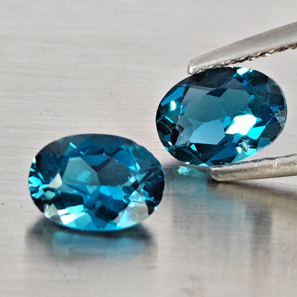 Natural London Blue Topaz Gemstones 2.17 Ct. 2 Pcs. Oval Shape 7.2 x 5.2 Mm. Natural London Blue Topaz Gemstones 2.17 Ct. 2 Pcs. Oval Shape 7.2 x 5.2 Mm.