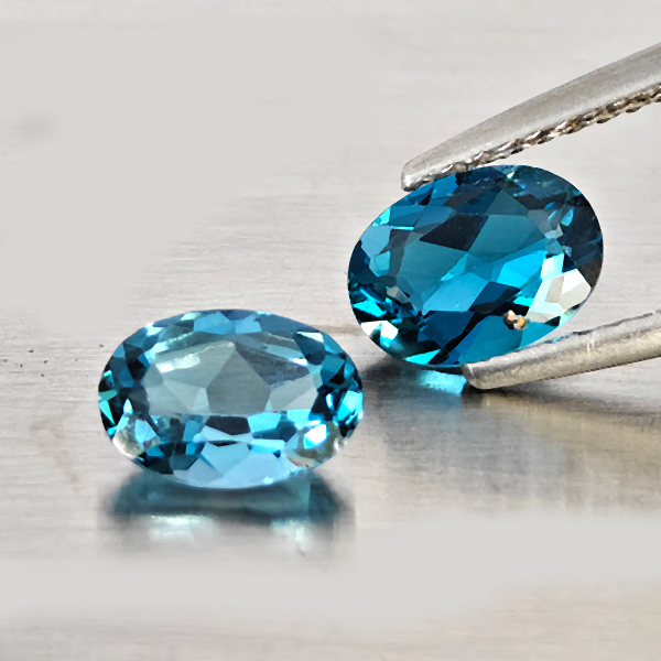 Natural London Blue Topaz Gemstones 1.68 Ct. 2 Pcs. Oval Shape 7 x 5.2 Mm. Natural London Blue Topaz Gemstones 1.68 Ct. 2 Pcs. Oval Shape 7 x 5.2 Mm.