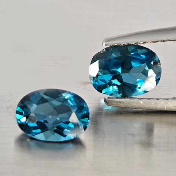 Natural London Blue Topaz Gemstones 1.89 Ct. 2 Pcs. Oval Shape 7.2 x 5.2 Mm. Natural London Blue Topaz Gemstones 1.89 Ct. 2 Pcs. Oval Shape 7.2 x 5.2 Mm.