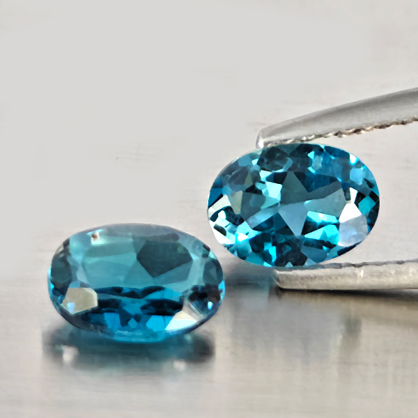 Natural London Blue Topaz Gemstones 2.07 Ct. 2 Pcs. Oval Shape 7.2 x 5.3 Mm. Natural London Blue Topaz Gemstones 2.07 Ct. 2 Pcs. Oval Shape 7.2 x 5.3 Mm.