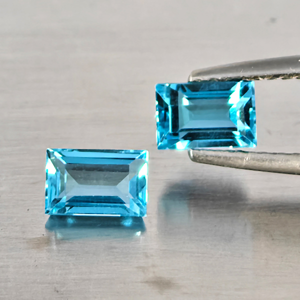 Natural Blue Topaz Gemstones 2.56 Ct. 2 Pcs. Baguette Shape 6.2 x 4.1 Mm. Natural Blue Topaz Gemstones 2.56 Ct. 2 Pcs. Baguette Shape 6.2 x 4.1 Mm.