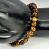 51.10 Ct. Round 6.4 Mm. Natural Brown Tigers Eye Beads Bracelet Length 7 Inch.