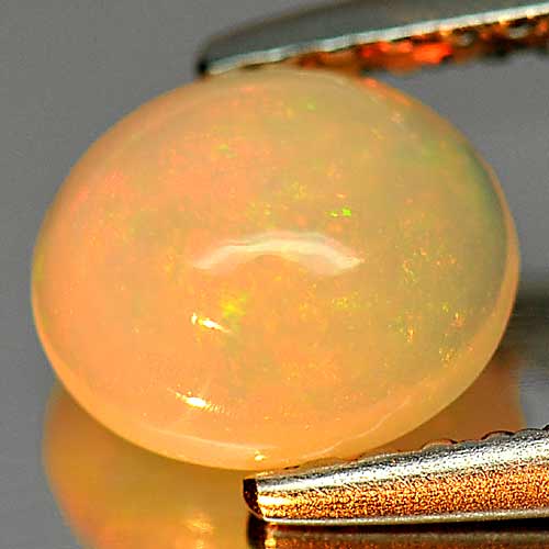 Play Of Colour Multi Color 0.75 Ct Oval Cabochon 7 x 6.1 Mm Natural Gem Ethiopia