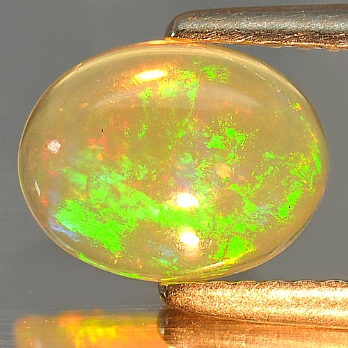 0.97 Ct. Oval Cab Natural Gem Multi Color Play Of Colour Opal Sz 9 x 7 Mm.